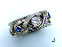 White Gold Vine and Trellis Ring with Round Center Diamond and side Sapphires