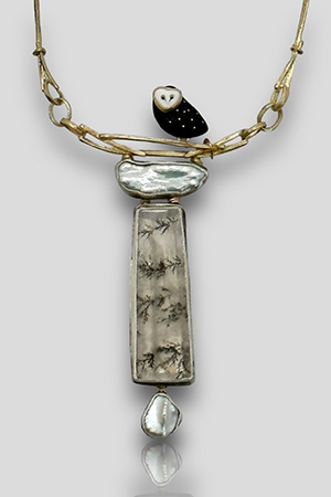 Carolyn Morris Bach Necklace with an Ebony owl sitting on a gold branch with dendritic quartz and pearl